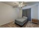 Bedroom featuring carpeted floors, a ceiling fan and a small nightstand at 3347 W Roma Ave, Phoenix, AZ 85017