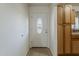 Bright entryway with a front door and adjacent cabinet at 3347 W Roma Ave, Phoenix, AZ 85017