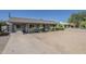 Single-story home with gravel front yard, covered walkway, and a concrete driveway at 3347 W Roma Ave, Phoenix, AZ 85017