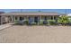 Charming single-story home featuring a gravel front yard and a covered entryway at 3347 W Roma Ave, Phoenix, AZ 85017