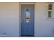Charming front door with decorative glass panel and painted trim at 3347 W Roma Ave, Phoenix, AZ 85017