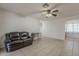 Cozy living room featuring tiled flooring and a comfortable couch at 3347 W Roma Ave, Phoenix, AZ 85017