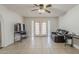 The living room features tile flooring, a ceiling fan, and access to the outdoor patio at 3347 W Roma Ave, Phoenix, AZ 85017