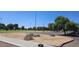 View of grassy park with trees and parking at 3347 W Roma Ave, Phoenix, AZ 85017