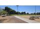 View of a neighborhood park featuring green spaces, trees, and walking paths on a clear day at 3347 W Roma Ave, Phoenix, AZ 85017