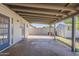 Covered patio featuring a concrete floor and a storage shed in the corner at 3347 W Roma Ave, Phoenix, AZ 85017