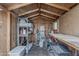 Interior of a storage shed with a workbench, shelves and assorted storage items at 3347 W Roma Ave, Phoenix, AZ 85017