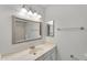 Neutral bathroom vanity and framed mirror provide ample space and storage at 3514 W Helena Dr, Glendale, AZ 85308
