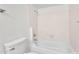 Clean bathroom featuring a bathtub with a tiled shower enclosure at 3514 W Helena Dr, Glendale, AZ 85308