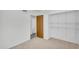 Empty bedroom with neutral carpet and wire rack shelving in the closet at 3514 W Helena Dr, Glendale, AZ 85308