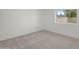 An empty bedroom featuring neutral colored walls and carpet at 3514 W Helena Dr, Glendale, AZ 85308