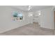 Neutral carpeted bedroom features a ceiling fan and standard closet at 3514 W Helena Dr, Glendale, AZ 85308