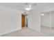 Bedroom features neutral carpet, ceiling fan and mirrored closet doors at 3514 W Helena Dr, Glendale, AZ 85308