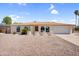 Charming single-story home with a well-maintained yard and beautiful desert landscaping at 3514 W Helena Dr, Glendale, AZ 85308