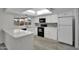 Bright kitchen featuring a skylight, modern countertops, and stainless steel appliances at 3514 W Helena Dr, Glendale, AZ 85308