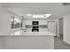 Modern kitchen featuring light countertops, stylish backsplash, white cabinetry, and stainless steel appliances at 3514 W Helena Dr, Glendale, AZ 85308