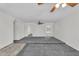 Spacious living room with neutral walls, plush carpeting, and stylish ceiling fans at 3514 W Helena Dr, Glendale, AZ 85308