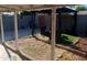 Backyard with seating under a pergola with a partially turfed yard at 3830 W Cavalier Dr, Phoenix, AZ 85019