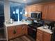 Well-lit kitchen with countertop, stainless steel appliances and ample storage at 3830 W Cavalier Dr, Phoenix, AZ 85019