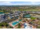 Aerial view of community amenities including pool, tennis courts, and lush landscaping at 3890 E Andalusia Ave, Gilbert, AZ 85298