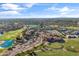 Community aerial showcasing golf course, lush landscaping, and a lake in a desirable neighborhood at 3890 E Andalusia Ave, Gilbert, AZ 85298