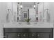 Stylish bathroom boasts a double vanity with quartz countertops, modern lighting, and elegant fixtures at 3890 E Andalusia Ave, Gilbert, AZ 85298