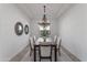 Elegant dining room features a decorative chandelier, modern decor, and space for hosting dinner parties at 3890 E Andalusia Ave, Gilbert, AZ 85298