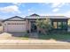 Charming brick home featuring a manicured lawn and a two-car garage, offering classic curb appeal at 3890 E Andalusia Ave, Gilbert, AZ 85298