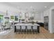 Spacious kitchen boasts a large center island, stainless steel appliances, and adjacent dining area for easy entertaining at 3890 E Andalusia Ave, Gilbert, AZ 85298