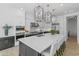 Gourmet kitchen featuring an oversized island, custom cabinetry, and professional-grade appliances for culinary enthusiasts at 3890 E Andalusia Ave, Gilbert, AZ 85298