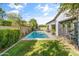 Private pool surrounded by manicured lawn and mature trees, perfect for relaxation and recreation at 3890 E Andalusia Ave, Gilbert, AZ 85298