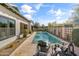Backyard features a sparkling pool, lush landscaping, and comfortable seating for outdoor living at 3890 E Andalusia Ave, Gilbert, AZ 85298
