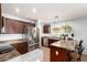 Bright kitchen with stainless steel appliances, breakfast bar, and ample cabinet space for convenient modern living at 40316 W Hopper Dr, Maricopa, AZ 85138