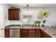 Charming kitchen features updated appliances, plentiful counter space, and stylish decor for a cozy cooking environment at 40316 W Hopper Dr, Maricopa, AZ 85138