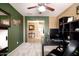 Home office with dark wood furniture, accent wall, and decor for a professional yet comfortable workspace at 40316 W Hopper Dr, Maricopa, AZ 85138