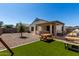 Backyard with artificial turf, pergola, and hot tub, perfect for outdoor entertainment at 4067 W Maggie Dr, San Tan Valley, AZ 85144