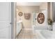 Well-lit bathroom with a bathtub, separate shower, and vanity with a sink and storage at 4067 W Maggie Dr, San Tan Valley, AZ 85144