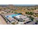 Aerial view of the San Tan Heights community pool and recreation center nestled in a desert landscape with mountain views at 4067 W Maggie Dr, San Tan Valley, AZ 85144