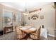 Traditional dining room featuring a wooden table, decorative wall shelves, and carpet flooring at 4067 W Maggie Dr, San Tan Valley, AZ 85144