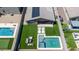 Aerial view of a home with a pool, seating area, and solar panels in a landscaped backyard at 4455 W Suncup Dr, San Tan Valley, AZ 85144