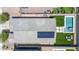 Aerial view showcasing the backyard oasis with a pool, spa, and solar panels on the roof at 4455 W Suncup Dr, San Tan Valley, AZ 85144