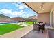 Backyard with a patio, swimming pool, and mountain views at 4455 W Suncup Dr, San Tan Valley, AZ 85144