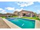 A large backyard features a pool, lounge area, and ample space for outdoor fun at 4455 W Suncup Dr, San Tan Valley, AZ 85144