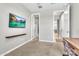 Versatile bedroom featuring a mounted TV, desk, and doorway leading to the bathroom, creating a functional space at 4455 W Suncup Dr, San Tan Valley, AZ 85144