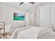 Bedroom with plush carpet, a ceiling fan, and a mounted TV at 4455 W Suncup Dr, San Tan Valley, AZ 85144
