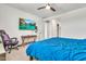 Serene bedroom is equipped with a ceiling fan, TV, and natural light from the window at 4455 W Suncup Dr, San Tan Valley, AZ 85144