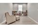 Playroom with wood-look floors, a chair with ottoman, and a play kitchen at 4455 W Suncup Dr, San Tan Valley, AZ 85144