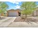 Attractive single-story home featuring a well-manicured front yard and a two-car garage at 4455 W Suncup Dr, San Tan Valley, AZ 85144