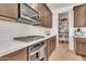 Modern kitchen with stainless steel appliances, a gas cooktop, and a walk-in pantry at 4455 W Suncup Dr, San Tan Valley, AZ 85144