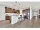 Well-equipped kitchen with island, stainless appliances, subway tile, and seating for two at 4455 W Suncup Dr, San Tan Valley, AZ 85144